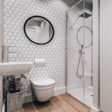 Discover the best small bathroom designs that will brighten up your space and make the whole room feel bigger! Maria Elianna Constantinou On Instagram Simple Yet Effective White Mini Hexagon Tile Feature Wall For Bathroom Feature Wall Shower Wall Tile Hexagon Tiles