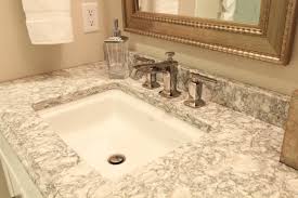 Carrara marble tile bathroom walls offer a perfect white backdrop in which you can add details like silvery faucets, flower vases or candelabras when having romantic moments with your spouse. Polished Nickel 8 Spread Vanity Faucet With Cambria Countertop And Gold Mirror Traditional Bathroom Other By Denise Quade Design Houzz