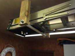 Hanging A Ladder From The Ceiling Ladder Storage Garage Storage Organizational Hacks