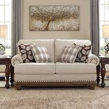 True Classic Character Comes To Life In The Harleson Loveseat By Signature Design Set Back Pleated Rolled Arms And Warm Brown Exposed Love Seat Furniture Home