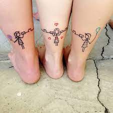 Three cupcakes of different designs and colors represent a different person in these sister symbol tattoos. Sister Tattoo Lovelovelove Sister Sisterlove Sistertattoos Tattoos Tattooedmom Inkedmom Mama Tattoos For Daughters Cousin Tattoos Cute Sister Tattoos