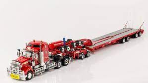 If you're an rc truck enthusiast, you've likely come to appreciate the realistic builds of tamiya trucks. Drake Trailer Combinations Kenworth T909 Prime Mover With Drake 2x8 Dolly And 4x8 Swingwing Trailer Rosso Red Model Truck Kits Kenworth Trucks