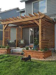Living So Close To Neighbors We Put Up A Little Privacy Wall On Our Pergola Patio Patio Design Backyard Patio