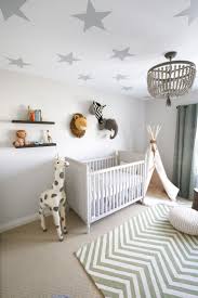 White And Grey Gender Neutral Safari Nursery With Green Chevron Beaded Chandelier And Faux Animal Hea Baby Nursery Decor Boy Nursery Themes Boy Nursery Colors
