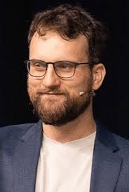 Red Deer Catholic school trustee who compared pride flags to swastika  banners is out