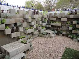 This durable, freestanding wall brings an attractive element to your yard that can zone off an outdoor patio area or add emphasis around flower beds and other landscaping. 1000 Ideas About Concrete Bags Cinder Block Garden Cinder Block Garden Wall Cinder Block