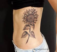 Black And Grey Sunflower Tattoo Black And Grey Sunflower On Ribs Tattoo By Kylie H Wild Artist Sunflower Tattoos Sunflower Tattoo Thigh Sunflower Tattoo Shoulder