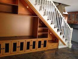 Solution For Open Space Under Staircase This Is Double Sided With Entertainment Center On One Side And Book Stairs Design Staircase Storage Home Stairs Design