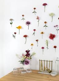 You can vary the size & quantity of fan flowers according to your wall size. Diy Floral Wall Backdrop The Merrythought