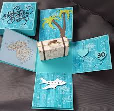 A cute cheerful and sweet box card for birthday or wedding using cardstock, pattern paper, pom pom, die cut, stamp, handmade flower etc. Explosionsbox Reise Ans Meer Und Palmen Handgearbeitet