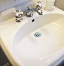 hard water stains from a porcelain sink