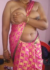 Desi MILF tantalizes with her big boobs in a pink silk saree and posing  almost topless