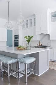 Kitchen islands can be social, smart and fun thanks to an endless array of seating options ranging from comfortable to practical. Blue Backless Stools At Gray Shaker Kitchen Island Transitional Kitchen