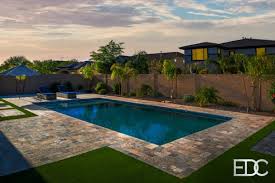 Synthetic grass can be placed on nearly any type of surface area. Swimming Pool Silver Travertine Synthetic Turf And Concrete Pavers In Gilbert Az Edgewater Design Company
