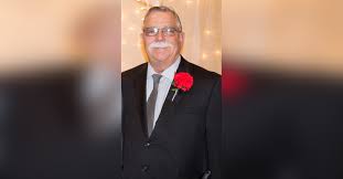 Obituary information for James M. "Mike" Huesman