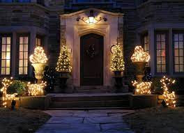 Pre Lit Potted Christmas Trees At Your Front Door Potted Christmas Trees Holiday Lights Outdoor Holiday Lights