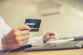 Check out our new music! Online Shopping A Young Man Holds A Credit Card To Make Payments Stock Photo Picture And Royalty Free Image Image 143047341