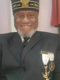 Sovereign Grand Inspector General Carl A. Williams presents to Sovereign  Grand Inspector General Robert Alexander a plaque for 24 Years of service  as Secretary for Bezaleel Consistory No. 15 in the Valley