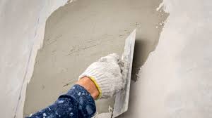 So with a blank canvas of stud walls and a concrete floor, we went to work. How To Resurface Concrete