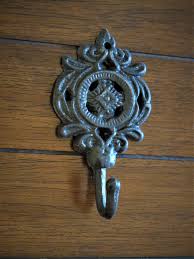 Blue donuts over the door hook and towel bar combo combines the best of two worlds for your bathroom. Vintage Style Small Cast Iron Wall Hook Oil Rubbed Bronze Or Pick Color Hand Towel Hanger Keys Jewelry Holder Buy Online In Aruba At Aruba Desertcart Com Productid 31990269