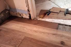 The glue will loosen and you may find your laminate threshold popping up. How To Lay Laminate In A Doorway For Perfect Flooring Transitions