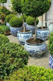 Pin By Karoline On Flowers A Garden White Planters Container Gardening Beautiful Gardens