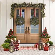 Pretty Holiday Decorating Ideas For Even The Smallest Spaces Christmas Front Doors Front Door Christmas Decorations Christmas Porch Decor