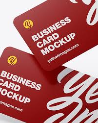 Hand holding a clothing label. Paper Business Cards In Stationery Mockups On Yellow Images Object Mockups