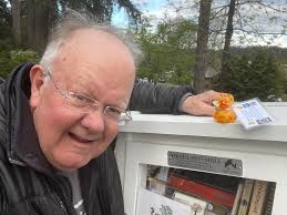 Just a brother and his little sister listening to a book about a duck