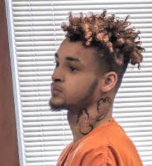 Polson man denies assaulting officer