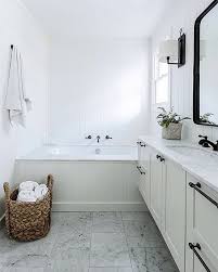 Black White And Marble In This Modern Farmhouse Bathroom Modern Farmhouse Bathroom Farmhouse Bathroom Decor Family Bathroom Design