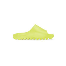 Underfoot, the outsole uses exaggerated flex grooves for enhanced traction. Yeezy Slide Glow Green Revealed