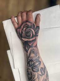 A rose tattoo can be large and monochrome, small and bright, simple or complex. Reposted Better Quality And Without The B W Filter Hand And Forearm Roses By Chloe Crown Of Thorns Chester And Vintage Tattoo Bolton Uk Tattoo Lover Family