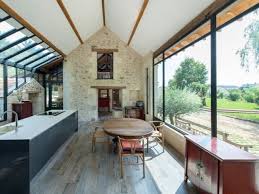 Extension Maison Une Veranda Imbriquee Entre Trois Batiments Existants Veranda Cuisine Extension Maison Cuisine Veranda Extensions