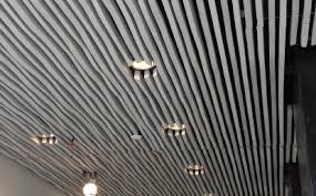 Design flexibility, acoustic performance, perforation options, color choices. Wavy Wood Ceilings Nach Spring Valley Archello