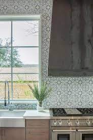 It feels like the walls of the kitchen were pushed back a foot, just from lightening the color of the tile! Handpainted Kitchen Tiles Design Ideas