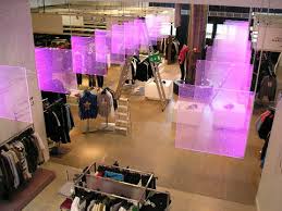 edge lighted led signage rotating coloured led edge lit acrylic hanging panels signage design retail design retail signage