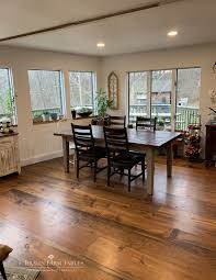 Quick pine wood flooring pros and cons: At The End Of This Open Floor Plan Is The Dining Area With A Braun Farmhouse Tab Wood Floors Wide Plank Wide Plank Hardwood Floors Living Room Hardwood Floors