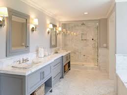 White cabinetry, neutral tiled walls and a tiled floor all work nicely together in this bathroom. Beach Home Is New But Features Classic Design Contemporary Bathrooms Marble Tile Bathroom House Bathroom