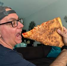 When you order two slices but they forget to cut them, you just fold it and  dig in. #pizza #delicious #icantbelieveiatethewholething