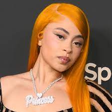 Ice Spice's striped catsuit gives naked dressing meets Beetlejuice