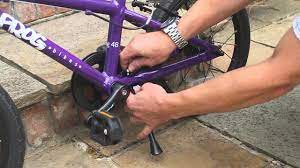 Below it, place the main kickstand part. How To Attach A Frog Kick Stand To A Kid S Bike Youtube