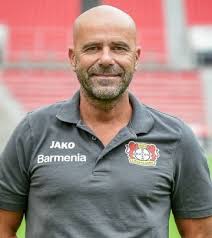 Peter bosz with a picture in the background. Peter Bosz Ned Photos Playmakerstats Com