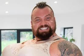 Meet the 355lb World's Strongest Man star who enjoys 'painting binges' and  'listening to birds chirp'