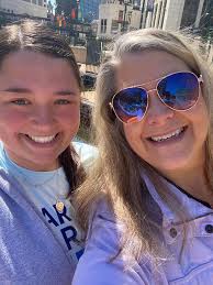 Dock Master Eleri Linscott and Marketing Manager Jenna Smith are standing  in the sun and putting some final touches