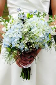 Ivy and clematis bouquet with blue silk wrap. Hydrangeas Great Idea For Adding That Something Extra To A Wild Flower Bouquet Hydrangeas Wedding Wedding Flowers Flowers Bouquet