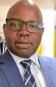 Meet Mr. Dominic Genge Mr. Dominic Genge is a respected leader whose  consistent excellence is recognized across every institution he serves. His  unwavering support and deep love for his community and country