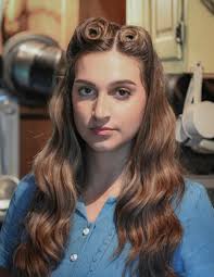 Who is the young lady with Kayden in the French village?