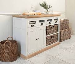 Two drawers and four classic fabric baskets sit in a floating, bottomless shelf allowing for maximum storage space in each basket. Wicker Baskets Used As Extra Storage In The Small Spaces