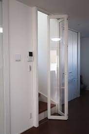 後付けでパネルの折れ戸取付事例 東京都世田谷区 折れ戸 リビング階段 引き戸